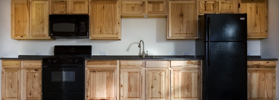 Kitchen cabinets and appliances in apartment