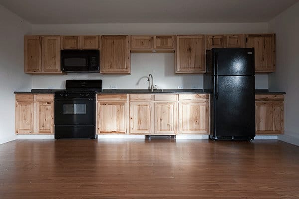 A kitchen apartment configuration against one wall